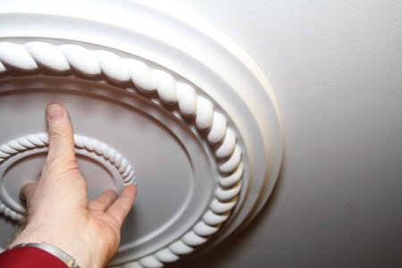 testing the fit of ceiling medallion for installation