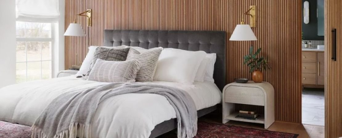 bedroom wall covered in natural wood tambour panels