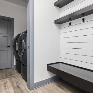 modern mudroom with floating shelves